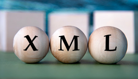 XML - acronym on wooden balls on the background of wooden large cubesの写真素材