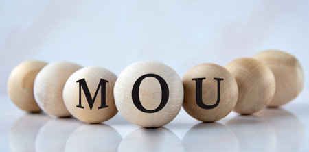 MOU - acronym on wooden balls on a light backgroundの写真素材