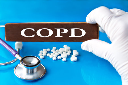 Cubes with the word COPD in the hand of a doctor. Medical conceptの写真素材