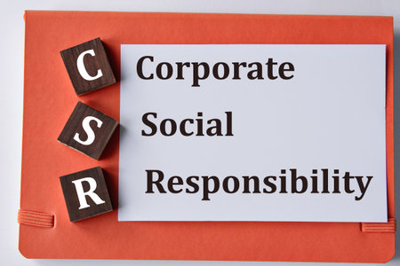 CORPORATE SOCIAL RESPONSIBILITY - words on a white sheet with a red background. Info concept