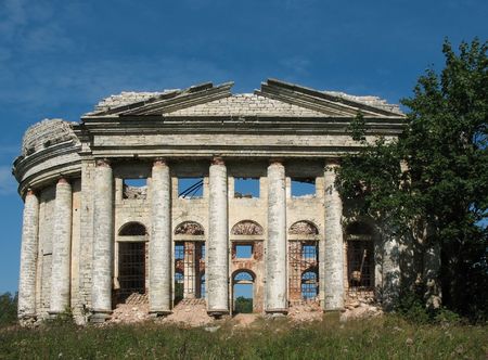 The ruins of the church against the blue skyの写真素材