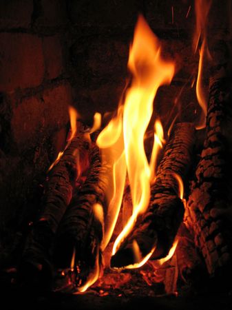 The fire in the stove. Discounted wood stove in the villageの写真素材