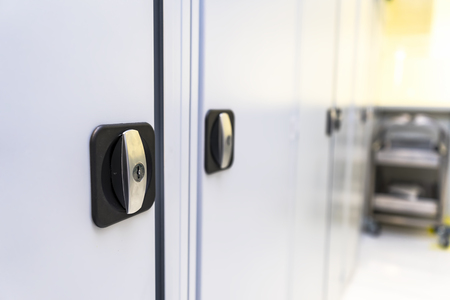 Doorknob in a metal cabinetの写真素材