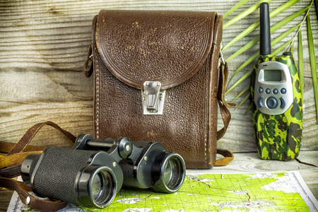 Old binoculars on wooden backgroundの写真素材