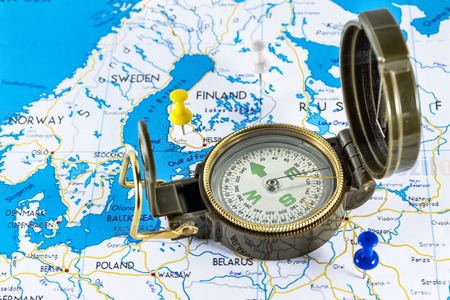 Magnetic compass on a world map conceptual of global travel , tourism and exploration.の写真素材