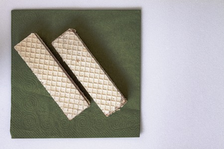 Waffles lying on a napkin, isolated on white.の写真素材