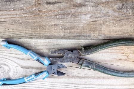 Old working tool on a wooden background