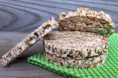 Round wheat crisp bread. Crusty bread composition on a wooden background.の写真素材