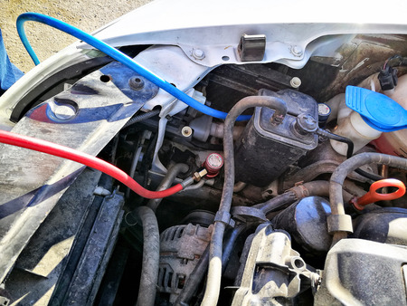 Servicing car air conditioner. Service station. Car repair