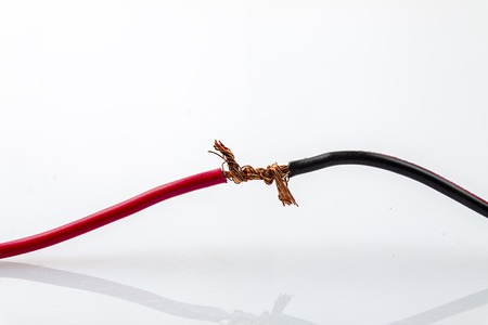 Twist the two wires on the light-house background.の写真素材