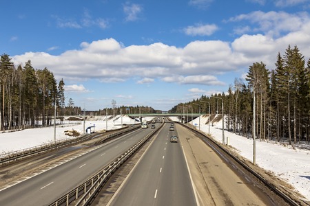 road in early spring, the snow has not melted.