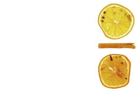 Cinnamon stick, dried lemon on a white background.の写真素材