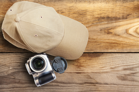 Baseball cap camera on a wooden background close-up.の写真素材