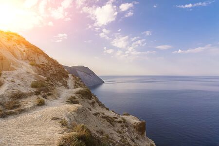 Evening over a high and steep seashore