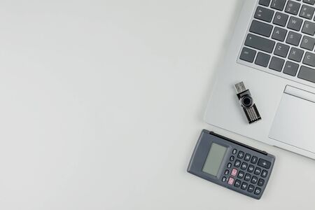 A laptop keyboard on it is a flash drive, and next to a calculator