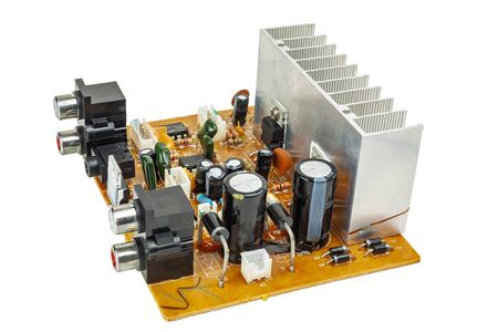 Electronic circuit board of audio amplifier close-up on a white backgroundの写真素材