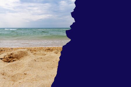 Photo of the sea half covered with torn blue paper
