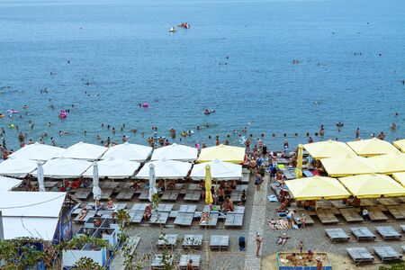 Russia, Anapa, 30.07.2019 City beach with many holidaymakers.のeditorial素材