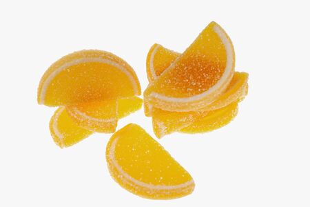 Slices of marmalade lie on a white backgroundの写真素材