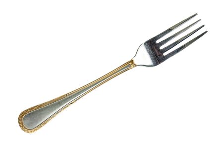The dining fork on a white background is a close-upの写真素材