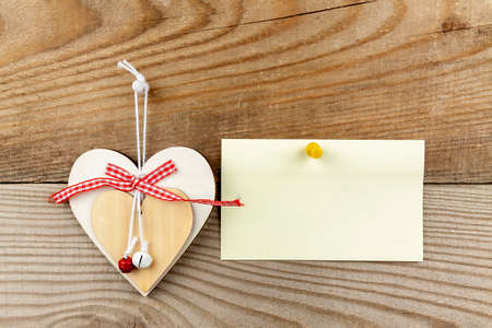 Hearts of wood on a wooden background.
