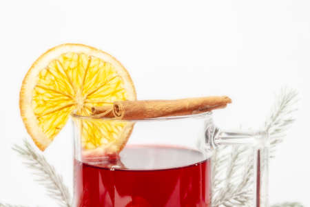 Mulled wine in a glass with a set for mulled wine on a white background.の写真素材