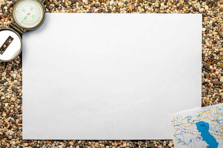 A template for text. Isolate with a compass, a map on a sandy background.の写真素材
