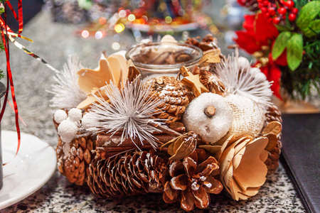 New Years candlestick lies on the festive table.の写真素材