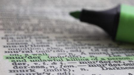 the word murder highlighted in green in the dictionaryの写真素材