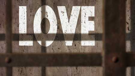 Love Written On A Wall With Jail Bars Shadowの写真素材