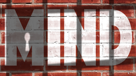 Mind Written On A Wall With Jail Bars Shadowの写真素材
