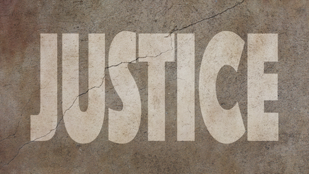 Justice Written on Cracked Concreteの写真素材