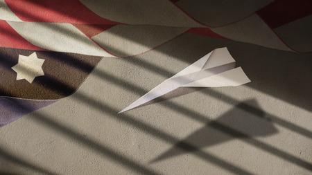 US Flag Clouds and Paper Airplane on Plasterの写真素材