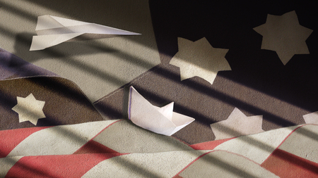 US Flag Waves Paper Boat and Airplane on Plaster with Shadowの写真素材