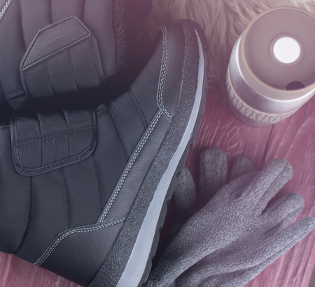 Black winter thermal boots with artificial fur and Velcro fastenerの写真素材