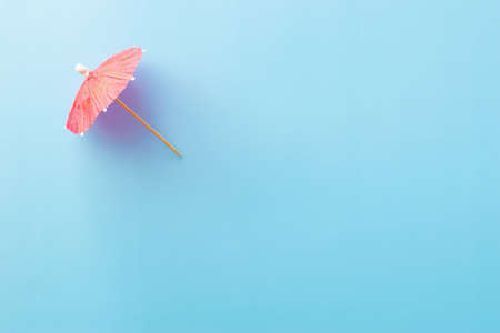 summer theme background with cocktail umbrellaの写真素材