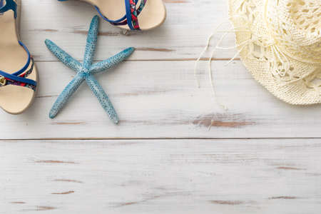 summer background concept: female sandals on light wooden surfaceの写真素材