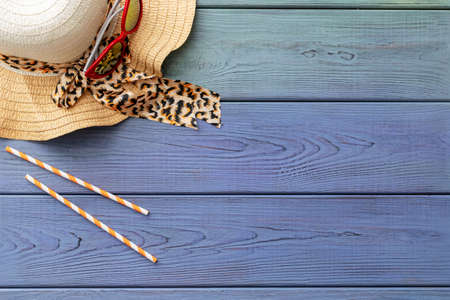summer background: photo frame, starfish, seashells on a blue wooden backgroundの写真素材