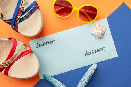 summer background: colored envelopes with seashellsの写真素材