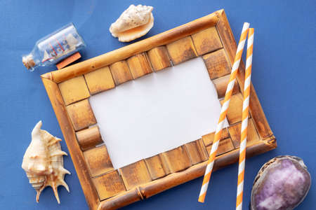 summer background: colored envelopes with seashellsの写真素材