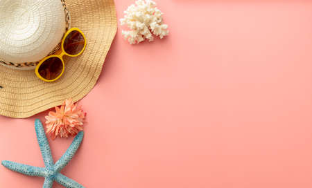 summer background of yellow sunglasses on pink backgroundの写真素材