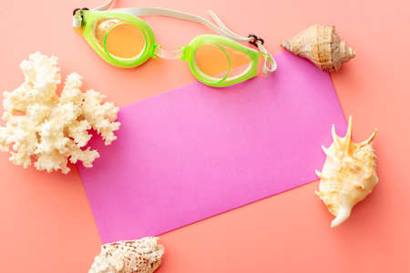 background image with summer vacation concept during quarantine: medical mask, seashells on pink backgroundの写真素材