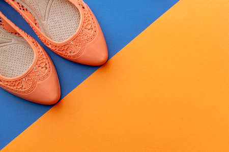 background image with summer vacation concept during quarantine: medical mask, seashells on pink backgroundの写真素材