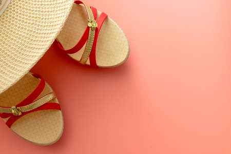 summer background of sandals, coral, starfish on pink backgroundの写真素材