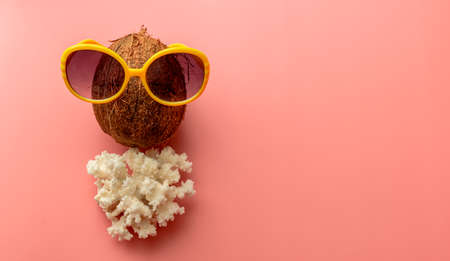 summer background of sandals, coral, starfish on pink backgroundの写真素材