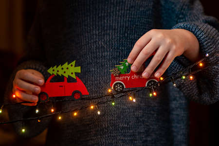 Christmas cars in the hands of a boyの写真素材