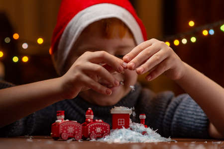 portrait of a boy of eight years old with New Year's decor with a snowflakeの写真素材