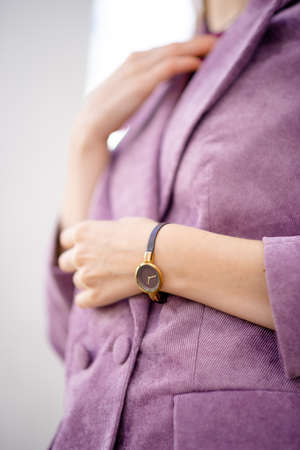 handbag made of wood in the hands of a girlの写真素材