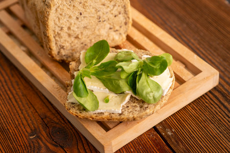 Healthy Whole Grain Bread with Brie Cheese and Fresh Basilの写真素材