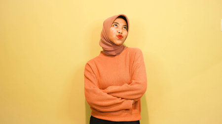 Portrait of a happy young asian muslim woman wearing hijabの写真素材